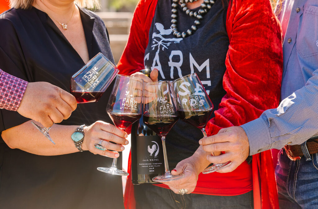 enjoying a glass of Farmhouse Vineyards wine